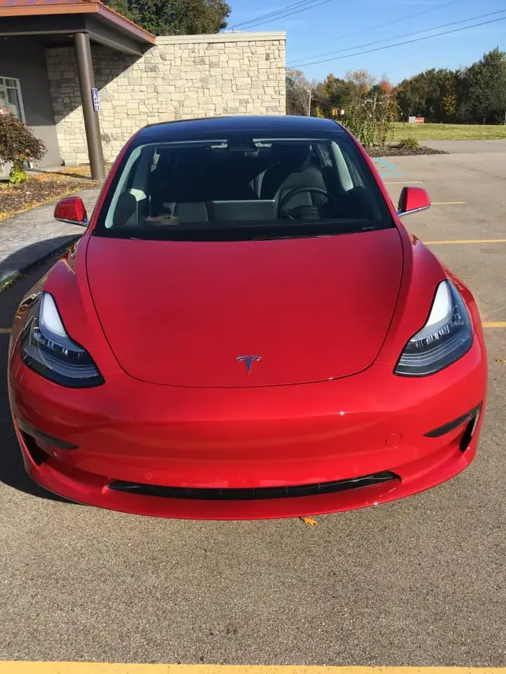 Red Tesla Model 3, front view